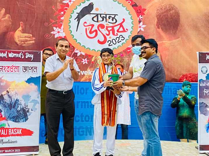 A potted sapling presented to a guest being felicitated at Basanta Utsav 2023