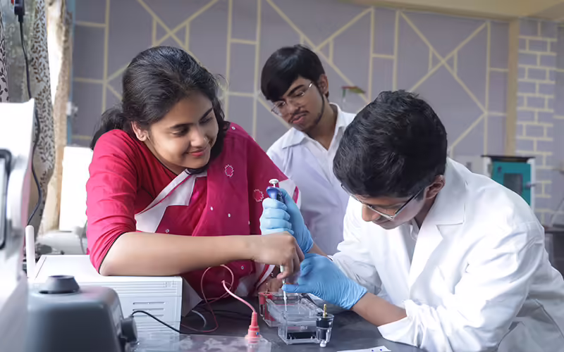 Students working at the benches in a university laboratory