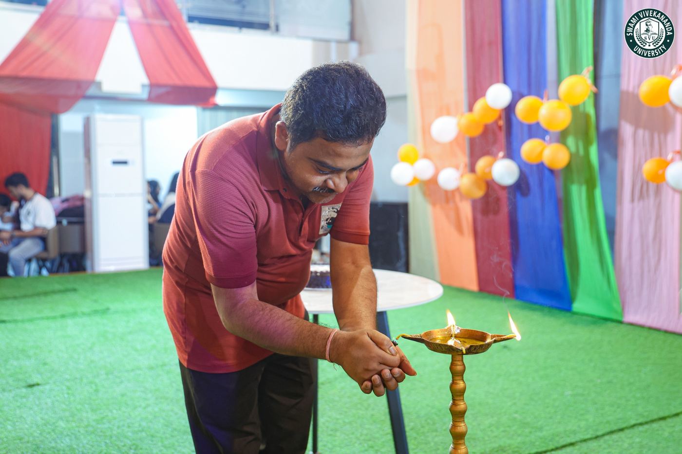Lighting the ceremonial lamp to open the NSS Day celebration
