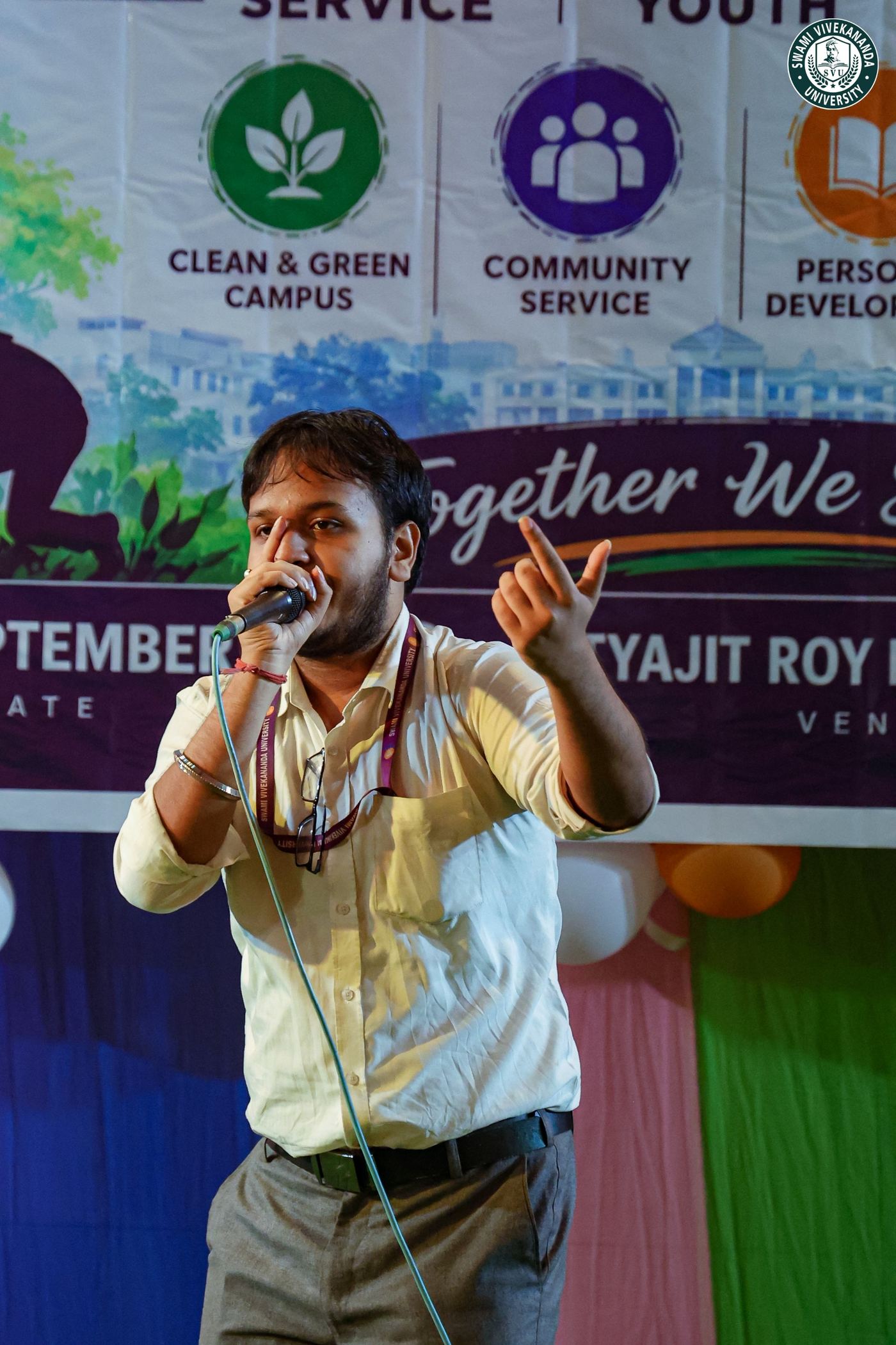 A student singing into a microphone on the NSS Day stage