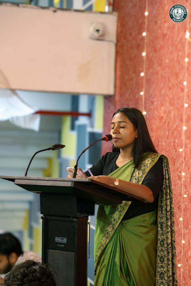 A student speaking at the lectern during the NSS Day celebration