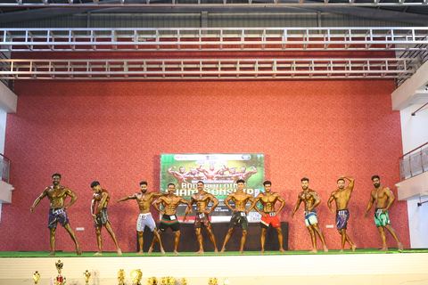 A competitor on stage at the Vivekananda Shree Open State Bodybuilding Championship