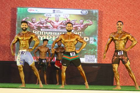 A competitor on stage at the Vivekananda Shree Open State Bodybuilding Championship