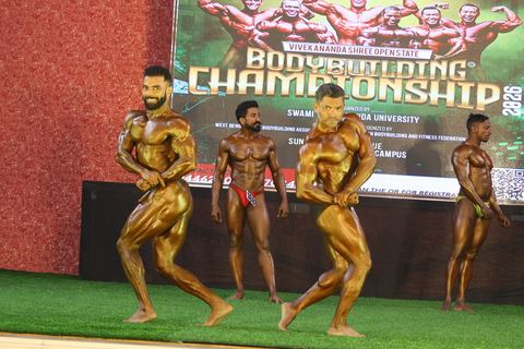 A competitor on stage at the Vivekananda Shree Open State Bodybuilding Championship