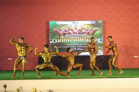 A competitor on stage at the Vivekananda Shree Open State Bodybuilding Championship