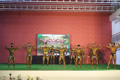 A competitor on stage at the Vivekananda Shree Open State Bodybuilding Championship