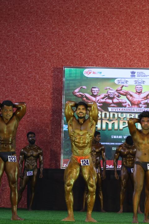 A competitor on stage at the Vivekananda Shree Open State Bodybuilding Championship