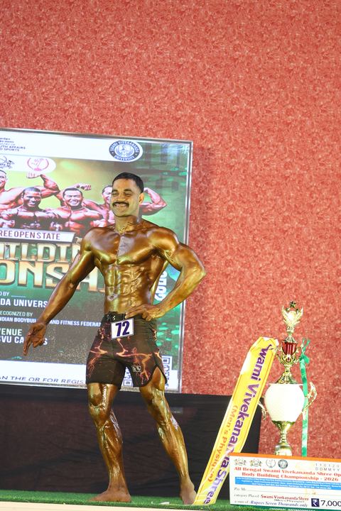 A competitor on stage at the Vivekananda Shree Open State Bodybuilding Championship