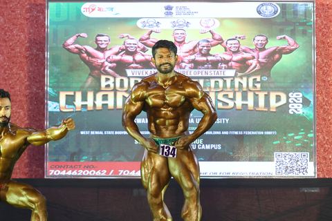 A competitor on stage at the Vivekananda Shree Open State Bodybuilding Championship