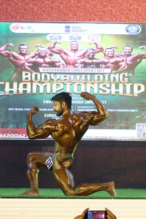 A competitor on stage at the Vivekananda Shree Open State Bodybuilding Championship
