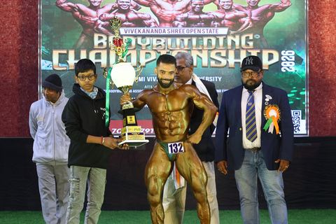 A competitor on stage at the Vivekananda Shree Open State Bodybuilding Championship