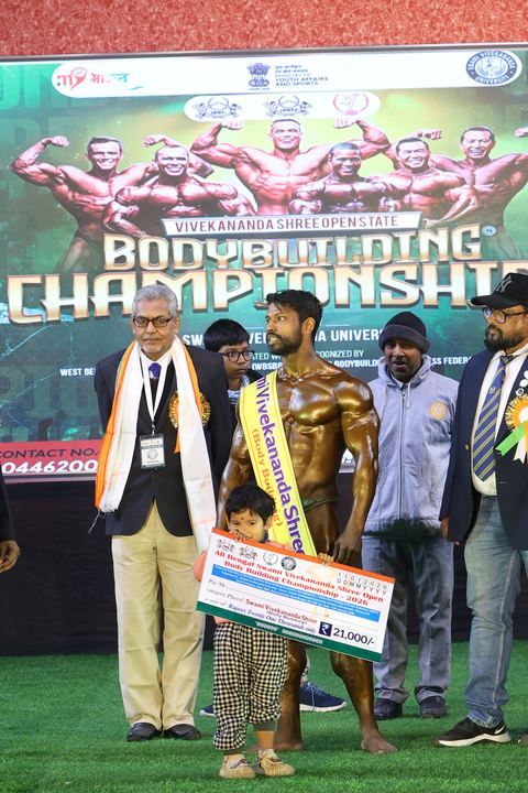 A competitor on stage at the Vivekananda Shree Open State Bodybuilding Championship