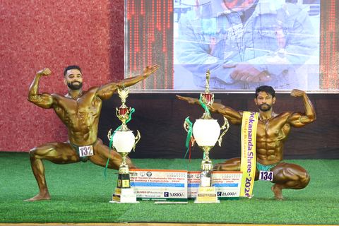 A competitor on stage at the Vivekananda Shree Open State Bodybuilding Championship