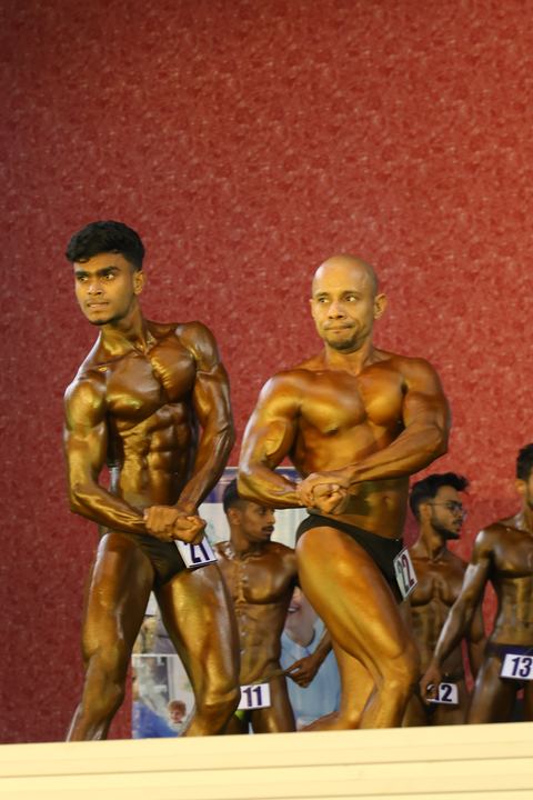 A competitor on stage at the Vivekananda Shree Open State Bodybuilding Championship