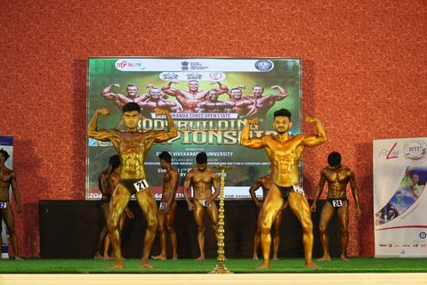 A competitor on stage at the Vivekananda Shree Open State Bodybuilding Championship
