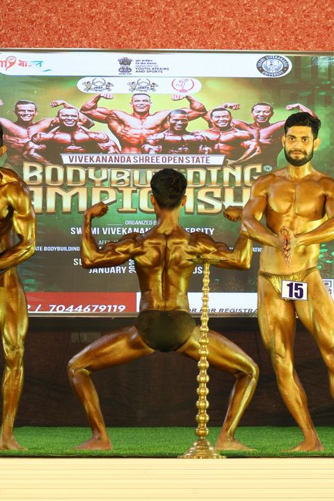 A competitor on stage at the Vivekananda Shree Open State Bodybuilding Championship