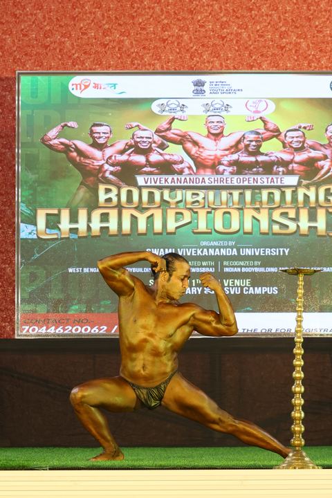 A competitor on stage at the Vivekananda Shree Open State Bodybuilding Championship