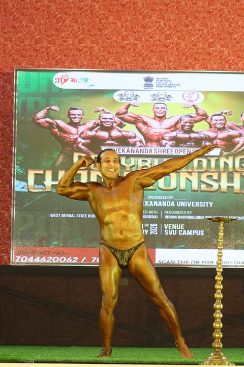 A competitor on stage at the Vivekananda Shree Open State Bodybuilding Championship