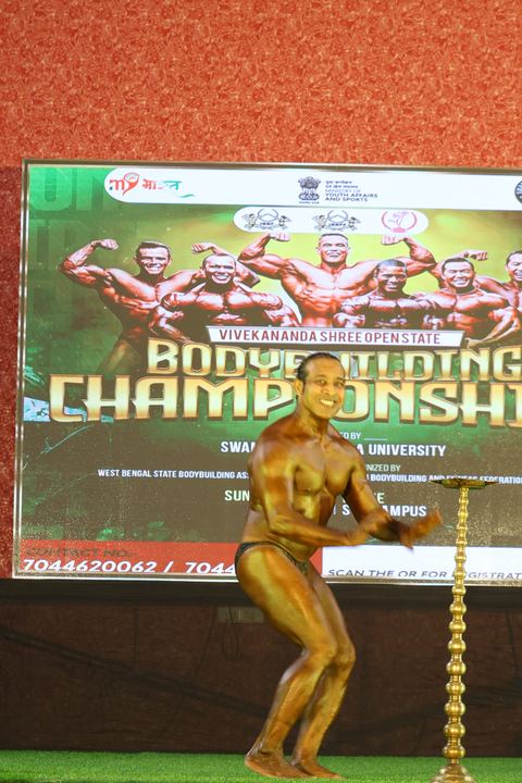 A competitor on stage at the Vivekananda Shree Open State Bodybuilding Championship