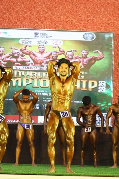 A competitor on stage at the Vivekananda Shree Open State Bodybuilding Championship