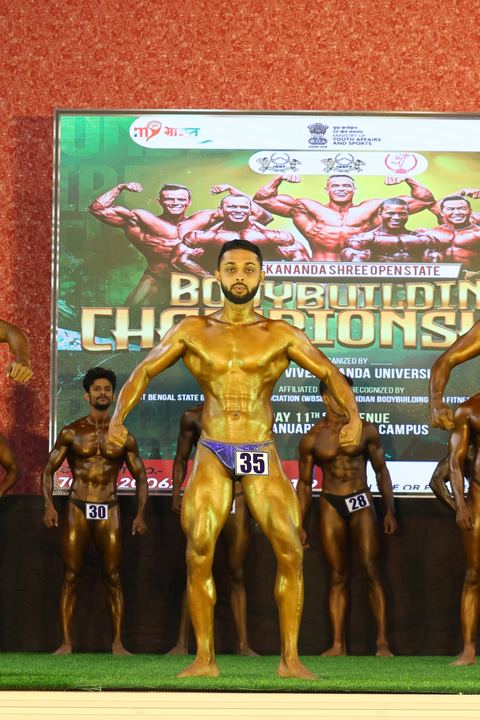 A competitor on stage at the Vivekananda Shree Open State Bodybuilding Championship
