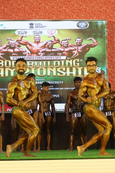 A competitor on stage at the Vivekananda Shree Open State Bodybuilding Championship