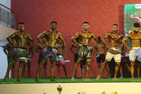 A competitor on stage at the Vivekananda Shree Open State Bodybuilding Championship
