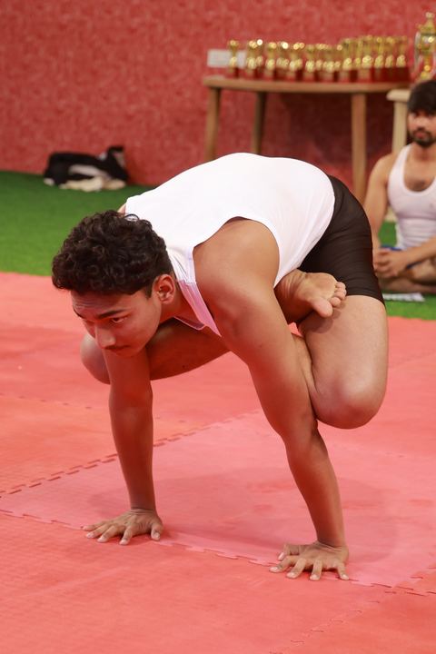 A student performing an asana at the yogasana competition on campus