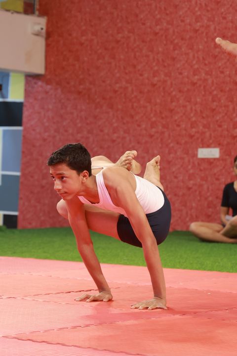 A student performing an asana at the yogasana competition on campus