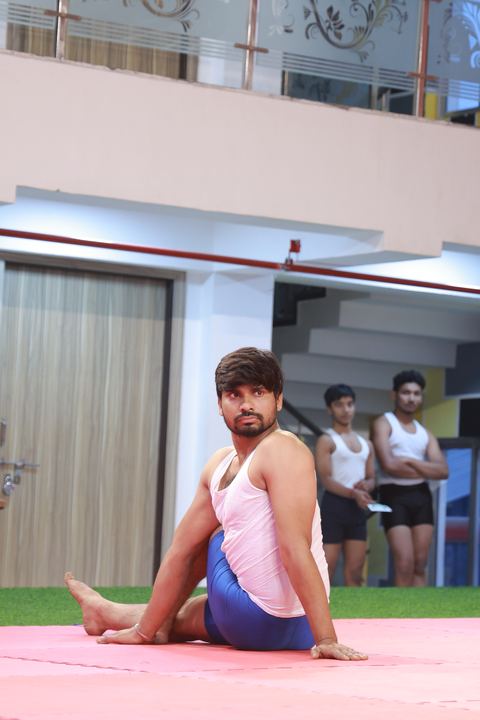 A student performing an asana at the yogasana competition on campus