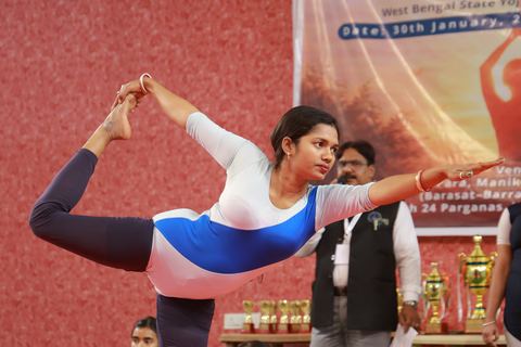 A student performing an asana at the yogasana competition on campus