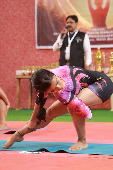 A student performing an asana at the yogasana competition on campus